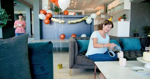 Senior Women Celebrating Birthday with Coffee and Decorations