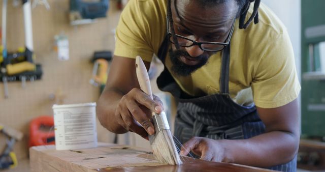 Craftsman Varnishing Wood Plank in Workshop - Download Free Stock Images Pikwizard.com