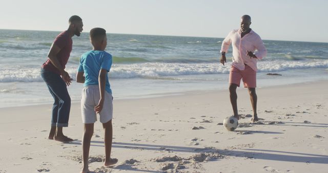 Family Playing Soccer on Beach during Sunny Day - Download Free Stock Images Pikwizard.com