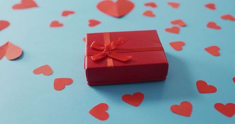 Red Gift Box Surrounded by Hearts on Blue Background for Valentine’s Day - Download Free Stock Images Pikwizard.com
