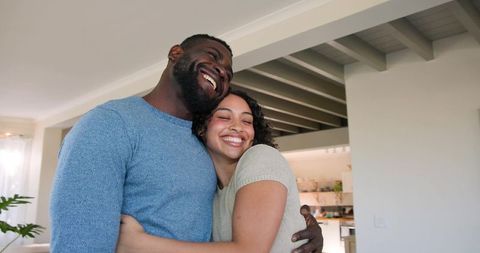 Loving Couple Embracing in Cozy Living Room
