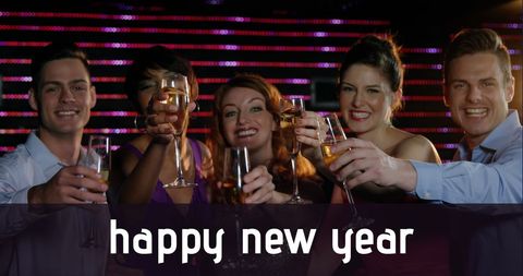 Festive Group Celebrating New Year with Champagne Toast - Download Free Stock Images Pikwizard.com