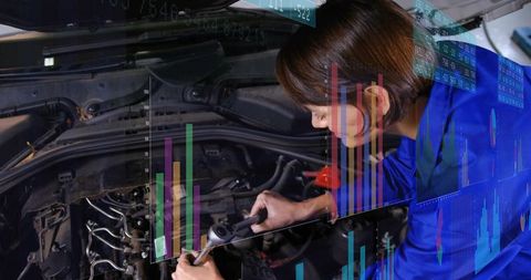Female mechanic leaning over engine holding ratchet with data overlay showing diagnostics