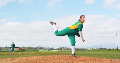 Female Pitchers in Action on Baseball Field