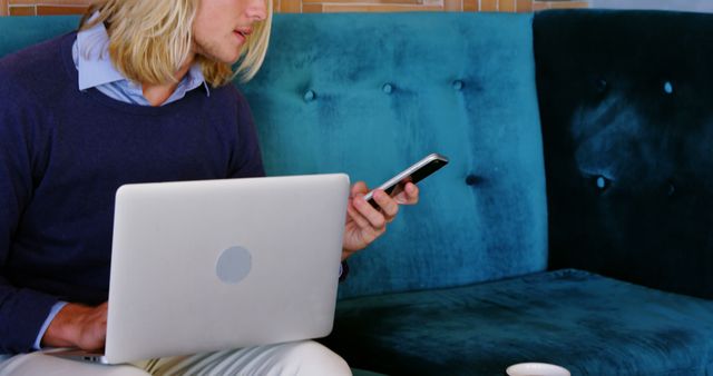 Businessman Using Smartphone and Laptop on Couch - Download Free Stock Images Pikwizard.com