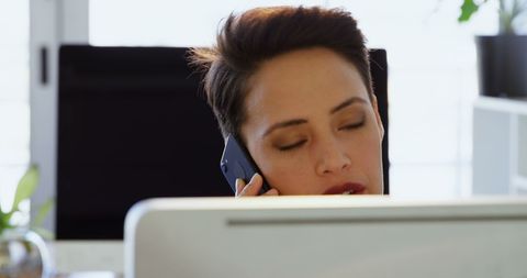 Focused Businesswoman Talking On Mobile Phone In Office - Download Free Stock Images Pikwizard.com