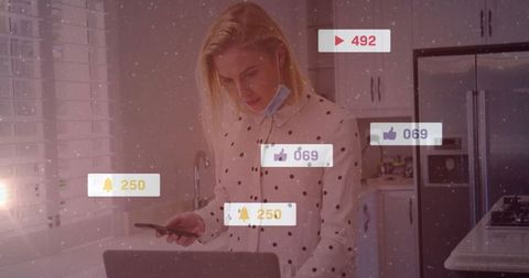 Woman Managing Social Media Notifications in Contemporary Kitchen