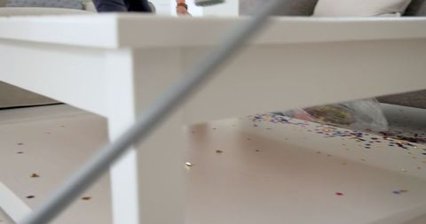 Cleaning up confetti before a celebration in living room
