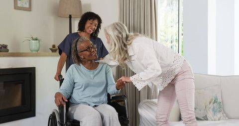 Caregiver assisting senior woman with support and friendship at home
