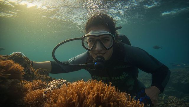 Scuba Diver Exploring Coral Reef in Clear Tropical Waters