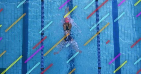 Dynamic Female Swimmer Diving in Pool with Vibrant Stripes