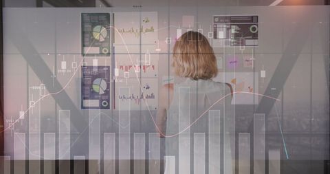 Businesswoman Analyzing Digital Charts in Modern Office