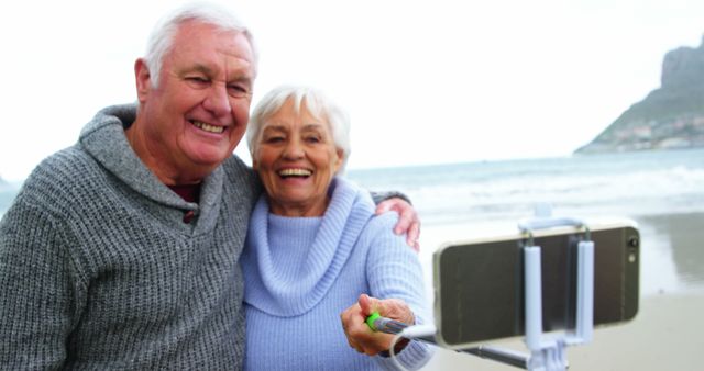 Smiling Senior Couple Taking Selfie on Beach with Smartphone - Download Free Stock Images Pikwizard.com
