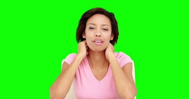Woman Relaxing with Hands on Neck against Green Screen Background - Download Free Stock Images Pikwizard.com