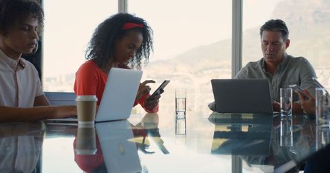 Business Team Working on Devices in Modern Office - Download Free Stock Images Pikwizard.com
