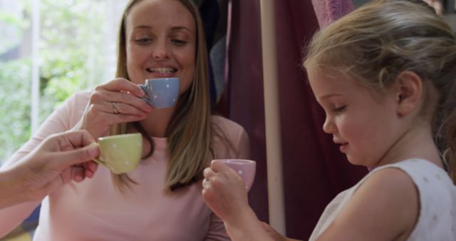 Mother and Daughter Enjoying Tea Party Together - Download Free Stock Images Pikwizard.com