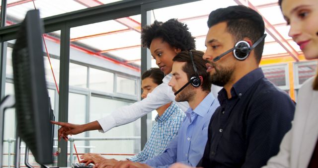 Diverse Call Center Team Collaborating on Computer Tasks - Download Free Stock Images Pikwizard.com