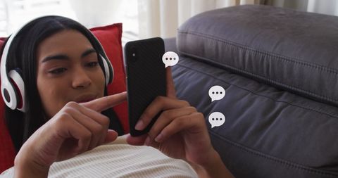 Tech-Savvy Young Woman Engaging with Social Media on Smartphone