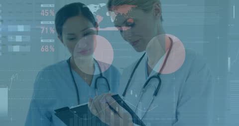 Female Doctors Examining Financial Data with Technology Interface