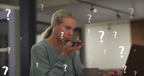 Businesswoman Using Voice Command with Overlayed Question Marks