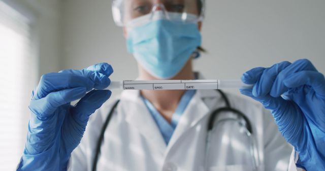 Healthcare Professional Holding DNA Sample Vial in Laboratory - Download Free Stock Images Pikwizard.com