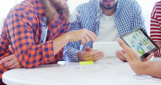 Business Team Analyzing Data on Tablet in Office Meeting - Download Free Stock Images Pikwizard.com