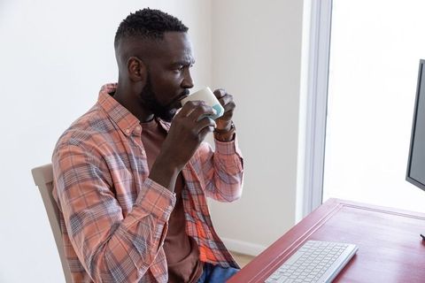 Professional Working from Home Enjoying Tea