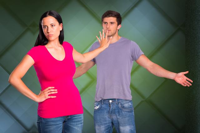 Angry woman showing stop gesture towards man - Download Free Stock Photos Pikwizard.com