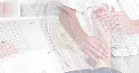 Doctor holding patient forearm while reviewing transparent medical charts and analytics