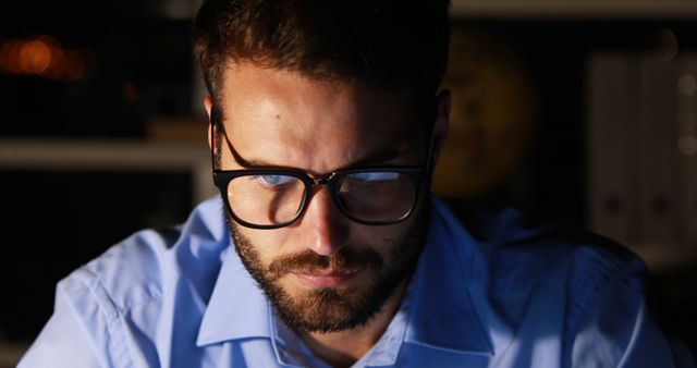 Focused Young Man Wearing Glasses Working Late at Night - Download Free Stock Images Pikwizard.com