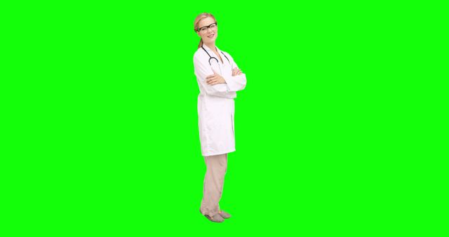 This high-quality stock image features a confident female doctor with a stethoscope around her neck standing against a green screen background. Ideal for medical, healthcare, or educational materials, presentations, and promotional content where a professional health practitioner is needed. The green screen allows for easy background alterations.