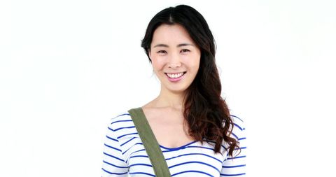 Smiling Young Woman in Striped Top with Shoulder Bag