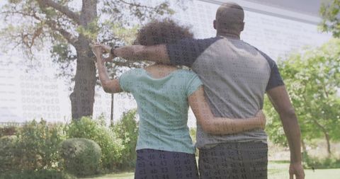 Couple Practicing Golf Swing in Sunny Backyard Setting