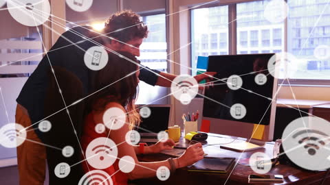 Collaboration on Digital Graphic Design Project in Modern Office