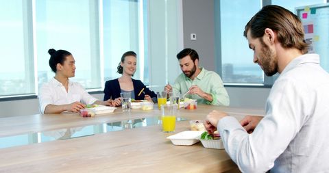 Business Executives Enjoying Lunch in Office Meeting Room - Download Free Stock Images Pikwizard.com