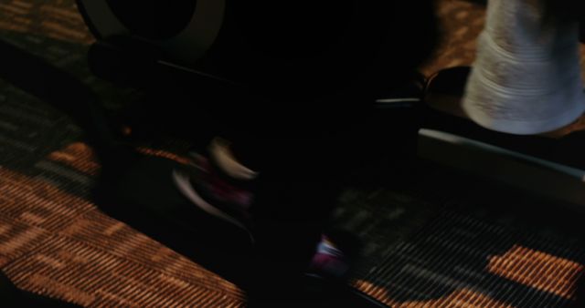 Blurred Motion of Feet Using Exercise Equipment in Dark Environment - Download Free Stock Images Pikwizard.com