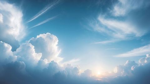 Vast Cumulus Cloudscape with Rising Sun on Horizon