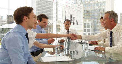 Diverse Business Team Meeting with Financial Data