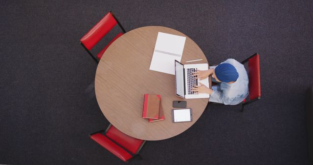 Overhead View of Female Student Studying in Library - Download Free Stock Images Pikwizard.com