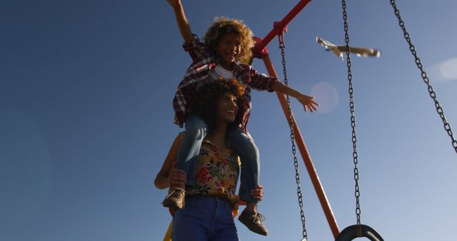 Mother and Child Having Fun on Swings at Playground - Download Free Stock Images Pikwizard.com