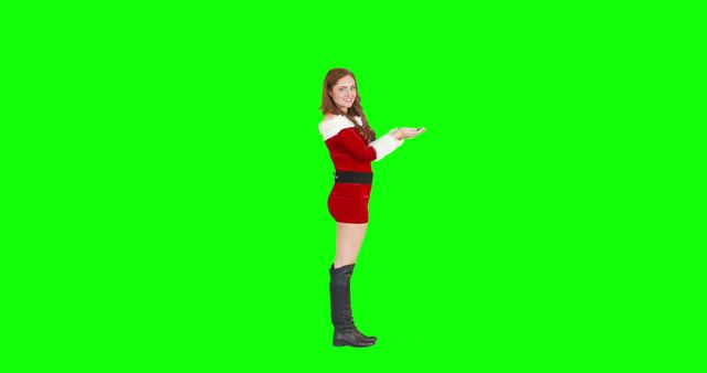 Smiling Woman in Santa Dress Presenting, Green Screen Background - Download Free Stock Images Pikwizard.com