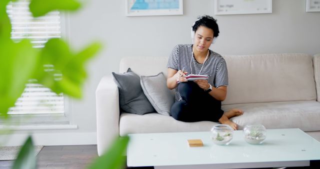 Young Woman Relaxing On Sofa At Home, Using Digital Tablet - Download Free Stock Images Pikwizard.com