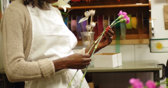 Florist Arranging Pink Flowers in Shop - Download Free Stock Images Pikwizard.com