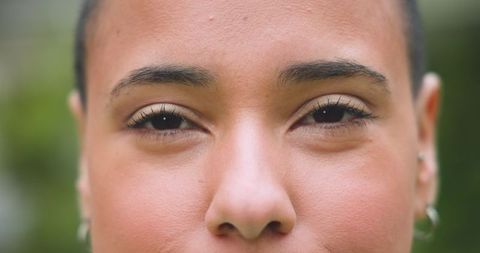 Serene portrait of woman outdoors amid lush greenery