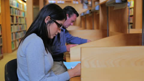 Focused Students Studying in Quiet Library Environment