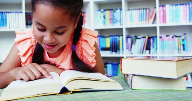 Young Girl Reading Book in Library with Focus and Interest - Download Free Stock Images Pikwizard.com