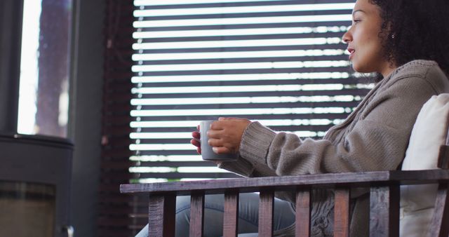 Woman Relaxing with Coffee Inside Cozy Home - Download Free Stock Images Pikwizard.com