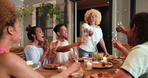 Diverse Friends Toast Celebrate Dinner Party Outdoors