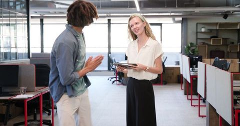 Colleagues Having Business Discussion in Modern Office
