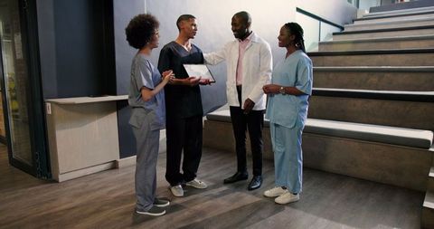 Multiracial Medical Staff Celebrating Success with Award Ceremony